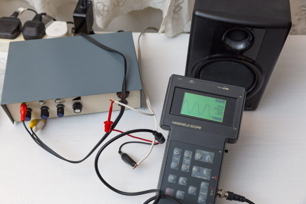 Handheld oscilloscope with sine wave