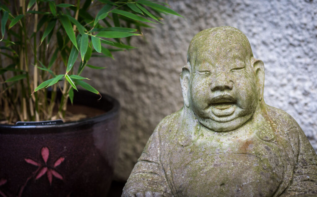 Stone buddha, and bamboo