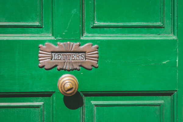 Letter box in green front door